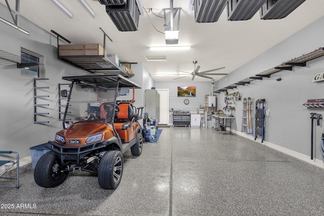 garage with baseboards and ceiling fan