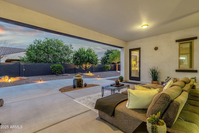 view of patio featuring an outdoor living space and a fenced backyard