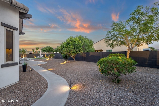 view of yard with a fenced backyard and a patio area