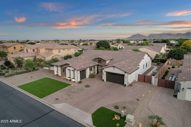 aerial view at dusk with a residential view and a mountain view
