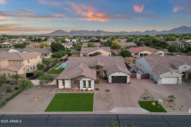 birds eye view of property featuring a residential view and a mountain view
