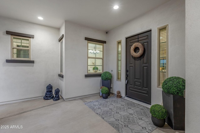 entrance to property with stucco siding