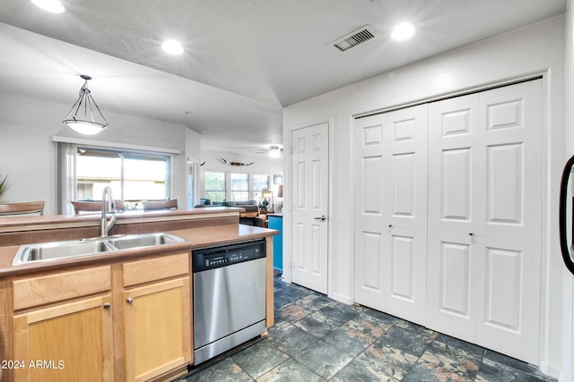 kitchen featuring a sink, visible vents, dishwasher, light brown cabinetry, and decorative light fixtures