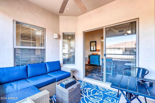 interior space featuring an outdoor hangout area and a ceiling fan