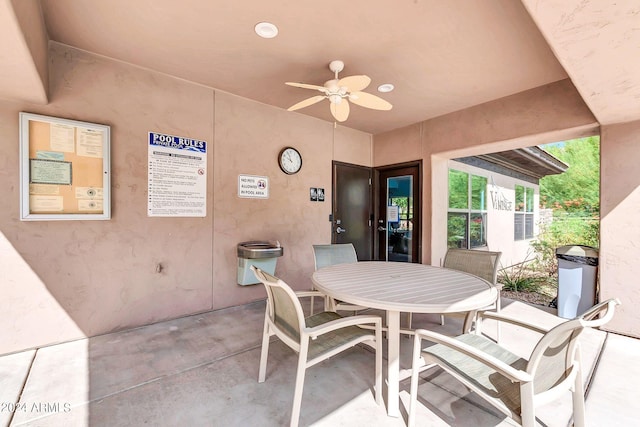 view of patio with a ceiling fan and outdoor dining area