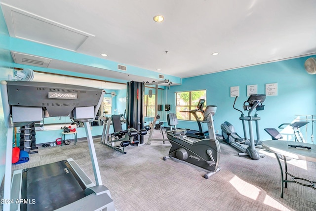 exercise room featuring recessed lighting, visible vents, and carpet