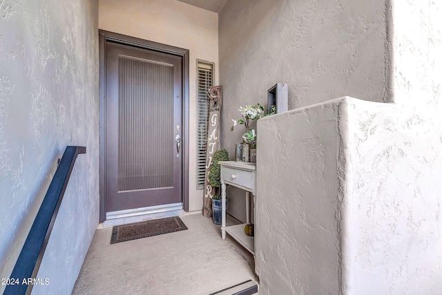 view of exterior entry with stucco siding