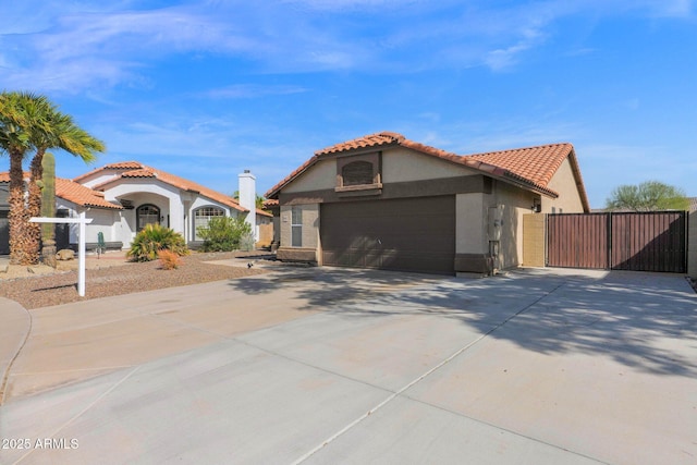 mediterranean / spanish home featuring a garage