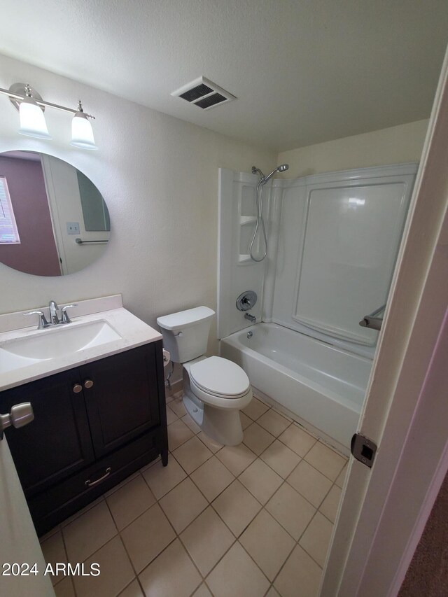 full bathroom featuring vanity, tile patterned flooring, toilet, and shower / bathtub combination