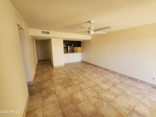 unfurnished room with ceiling fan