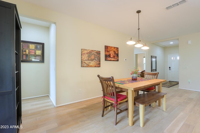 dining area featuring light wood-type flooring