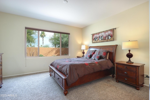 bedroom featuring light carpet