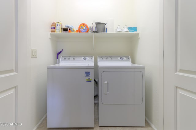 clothes washing area featuring washing machine and clothes dryer