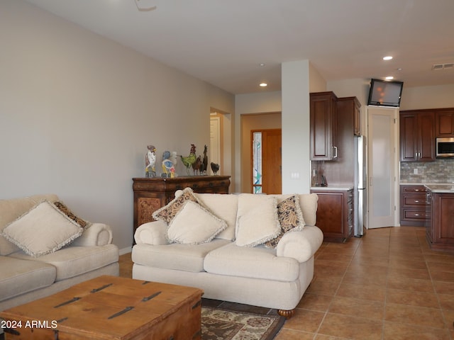 living room with light tile patterned floors