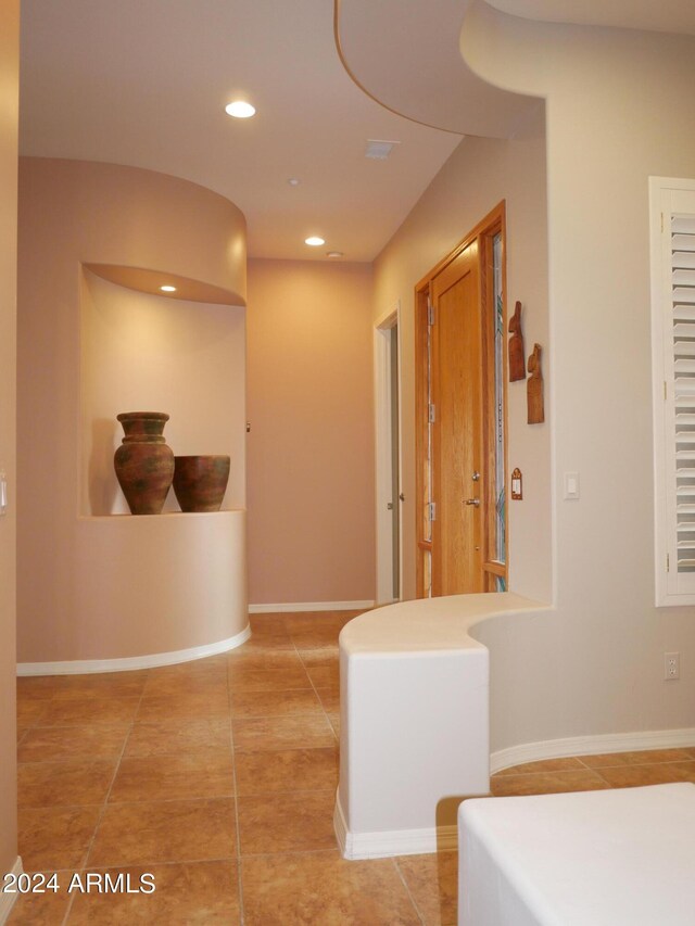 corridor featuring tile patterned floors