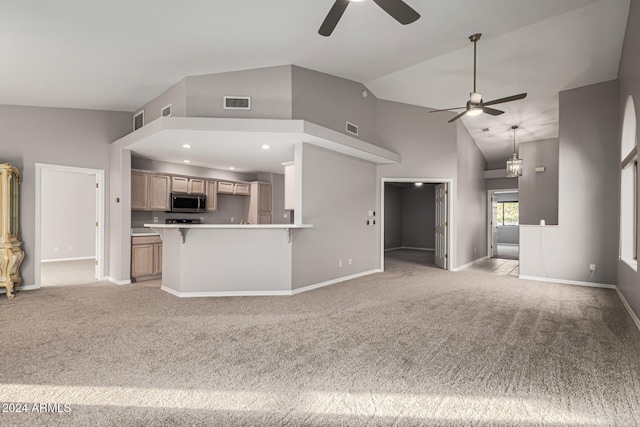 unfurnished living room featuring light colored carpet, high vaulted ceiling, and ceiling fan