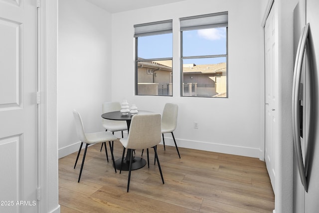 dining room with light hardwood / wood-style flooring