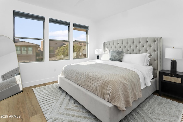 bedroom with hardwood / wood-style flooring