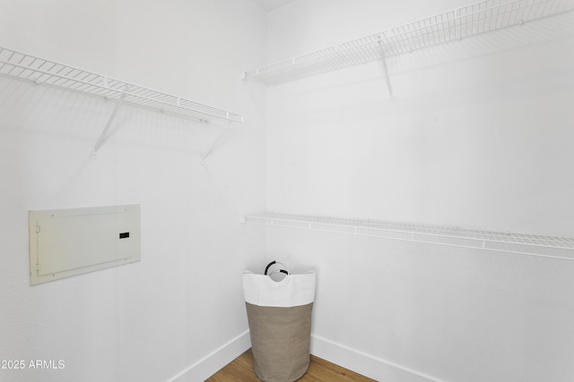 clothes washing area featuring wood-type flooring