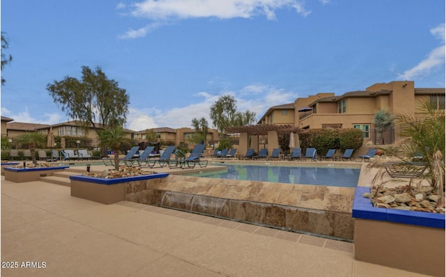 view of swimming pool featuring a patio area