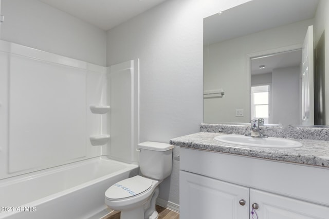 full bathroom featuring shower / tub combination, hardwood / wood-style floors, vanity, and toilet