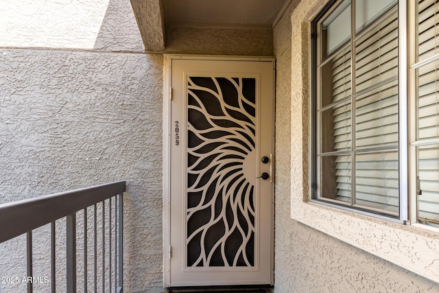 doorway to property with a balcony