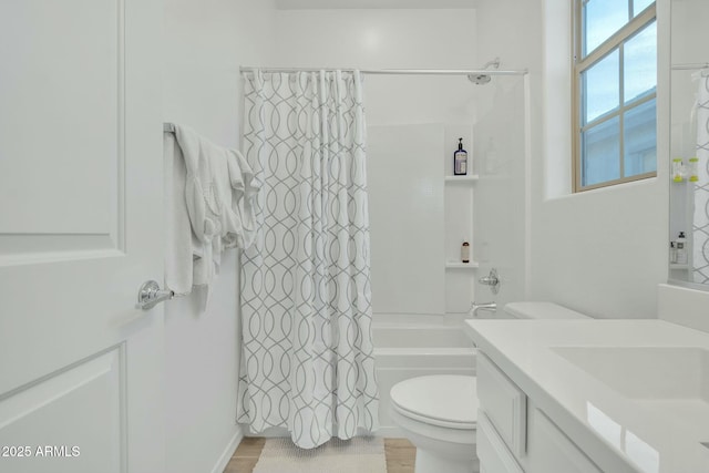 full bathroom with hardwood / wood-style flooring, toilet, vanity, and shower / bath combo