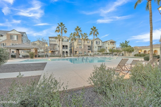 view of pool featuring a patio and a gazebo