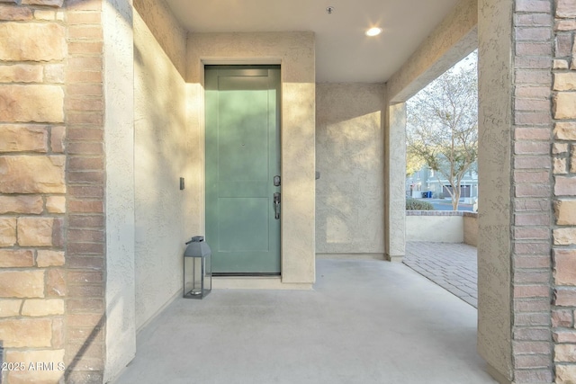 doorway to property with a patio