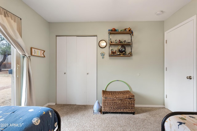 bedroom featuring light colored carpet and a closet