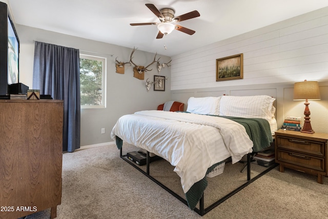 bedroom with ceiling fan and light colored carpet