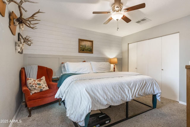 bedroom with ceiling fan, a closet, and carpet