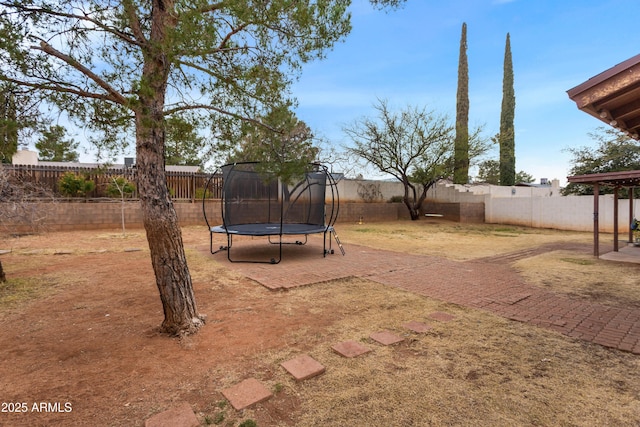 view of yard featuring a trampoline