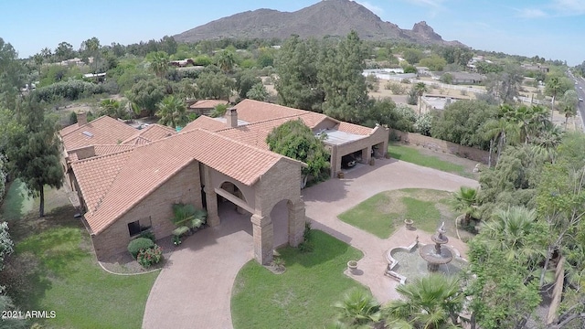 birds eye view of property with a mountain view