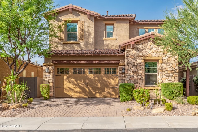 mediterranean / spanish-style house featuring a garage