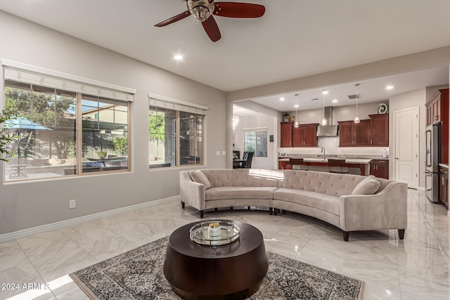 living room with sink and ceiling fan