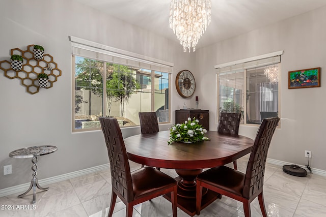 dining room with a notable chandelier