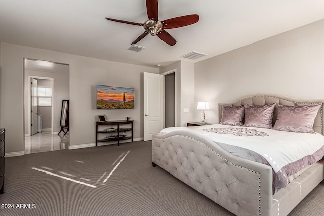 bedroom featuring light colored carpet and ceiling fan