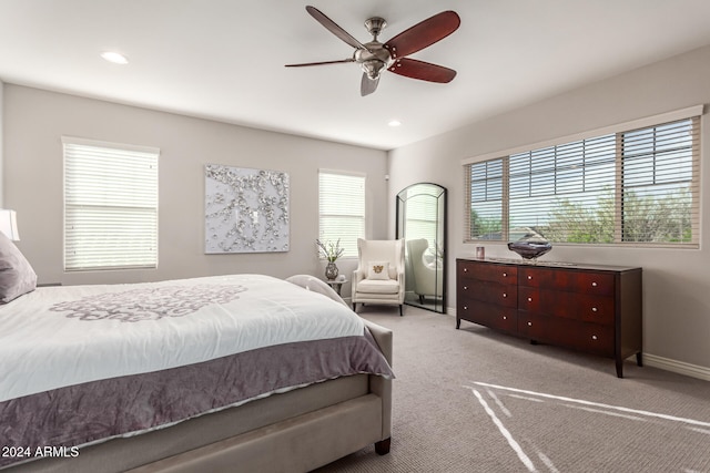 carpeted bedroom featuring ceiling fan