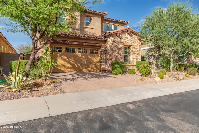 mediterranean / spanish-style home featuring a garage