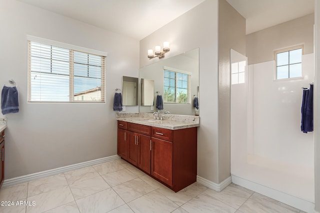 bathroom with vanity and a wealth of natural light