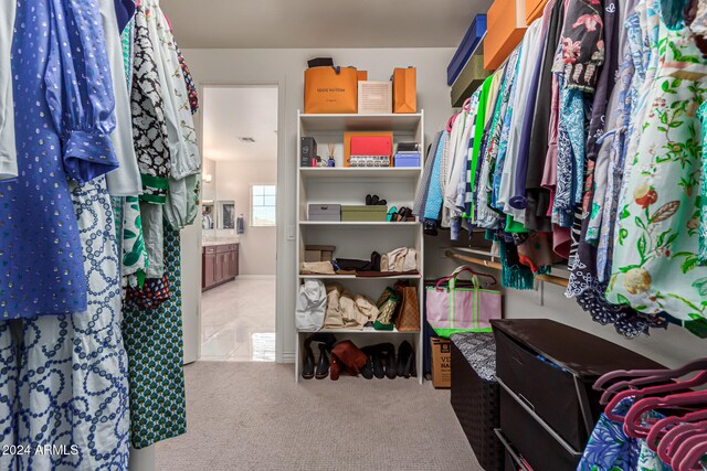 spacious closet with carpet flooring