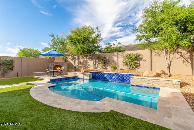 view of pool featuring a patio and a lawn