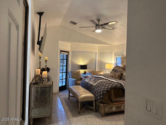 11028 W Crimson Ln, Avondale, AZ 85392 - bedroom with lofted ceiling, wood finished floors, and a ceiling fan
