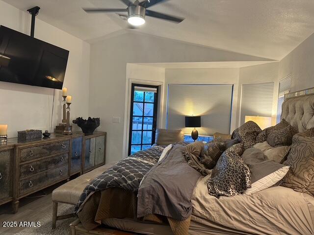 11028 W Crimson Ln, Avondale, AZ 85392 - bedroom featuring lofted ceiling, wood finished floors, and a ceiling fan