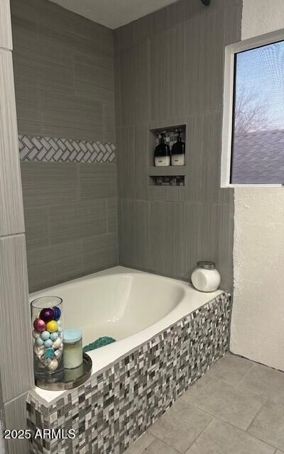11028 W Crimson Ln, Avondale, AZ 85392 - full bathroom with tiled tub and tile patterned floors