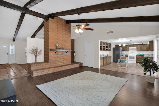 living room featuring ceiling fan, beam ceiling, visible vents, and wood finished floors