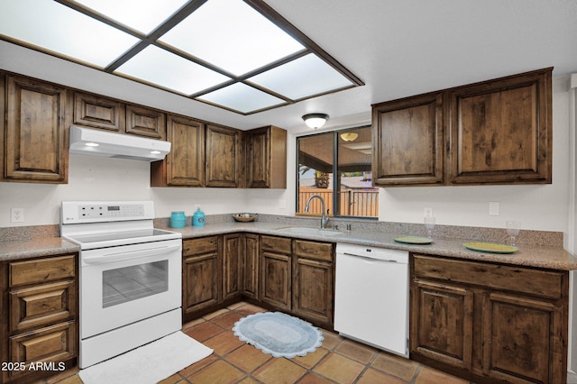 kitchen with under cabinet range hood, white appliances, light tile patterned flooring, a sink, and dark brown cabinetry