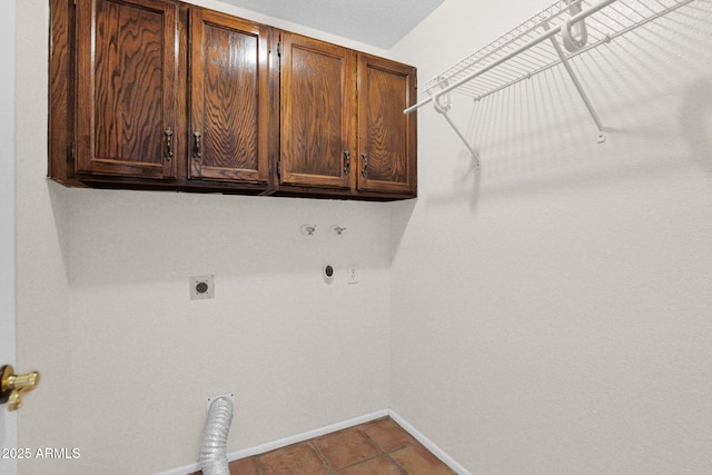 washroom with hookup for an electric dryer, cabinet space, baseboards, and hookup for a gas dryer