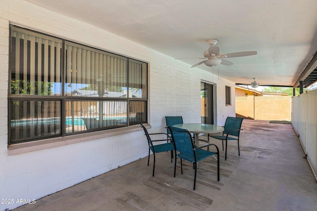 view of patio / terrace featuring outdoor dining area, ceiling fan, and fence